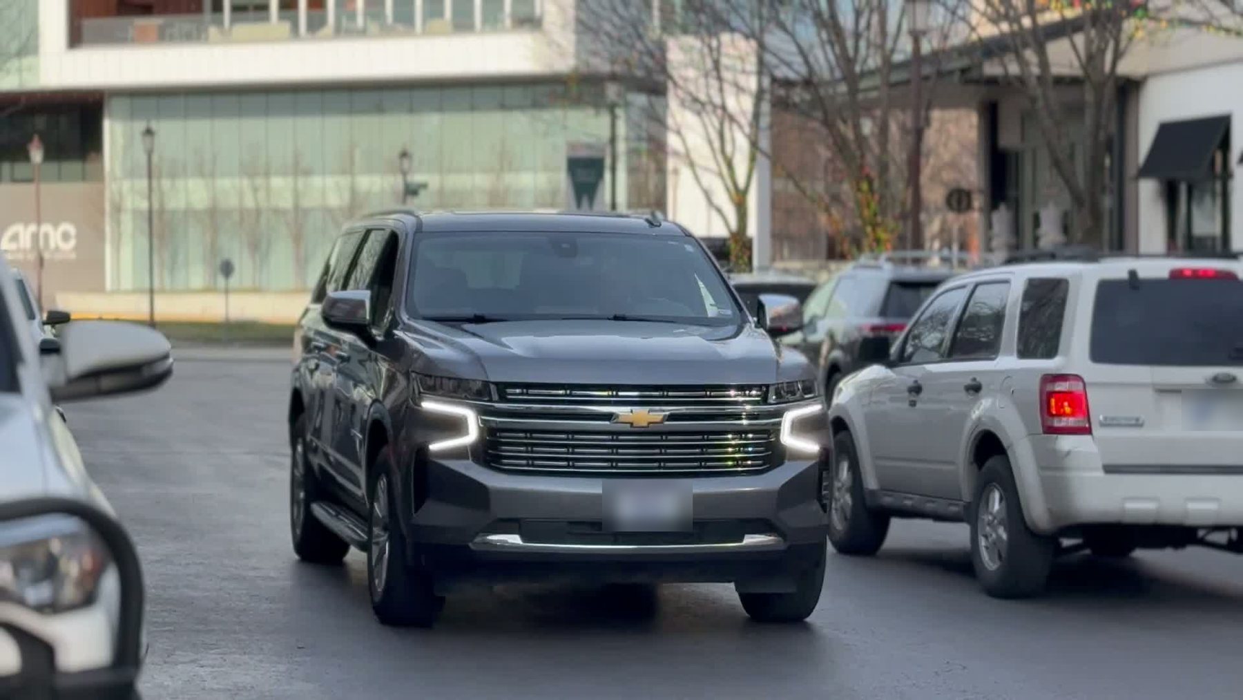 WRIGHT & Co. Chevrolet Suburban arriving on a city street